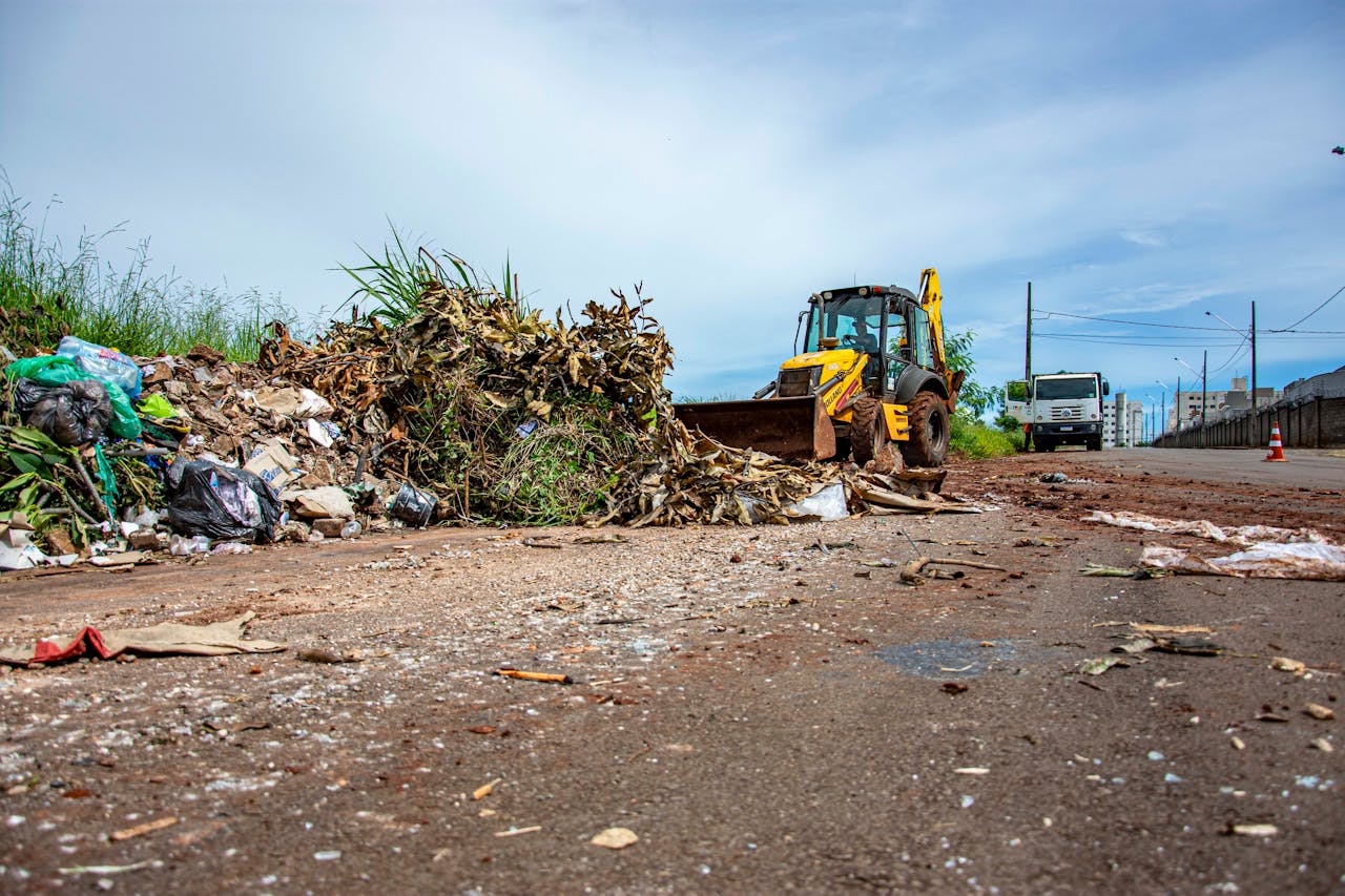 services-01 Street cleaning operation with bulldozer and debris in Londrina, Brazil.